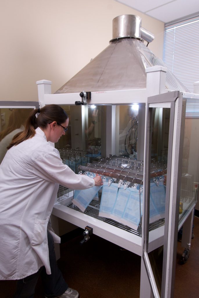 Lab expert performing aerosol test at Nelson Labs 